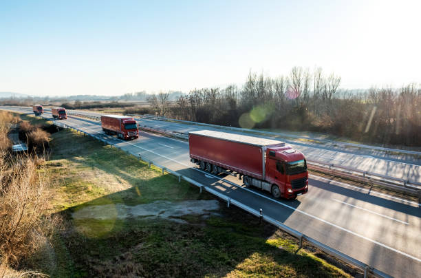 istock Convoy of red trucks with trailers 2155204371
