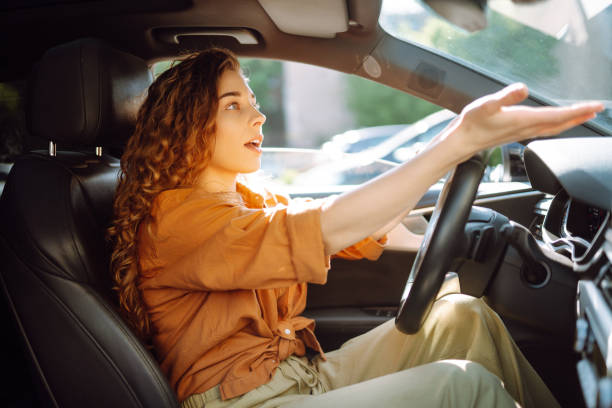 istock Relaxed woman enjoys drive while sitting in a car. 2155205138