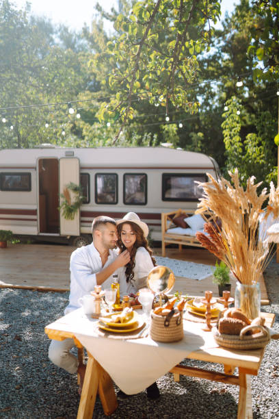 istock Beautiful wedding couple in camping trailer. 2155205844