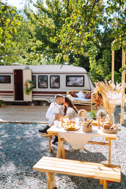 istock Beautiful wedding couple in camping trailer. 2155205846
