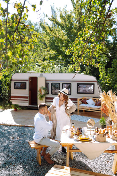 istock Beautiful wedding couple in camping trailer. 2155205849
