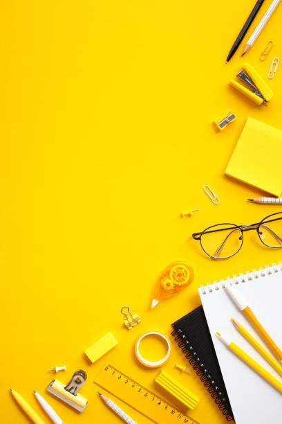 istock Modern office supplies on vertical yellow background. Flat lay, top view, copy space. 2155208010