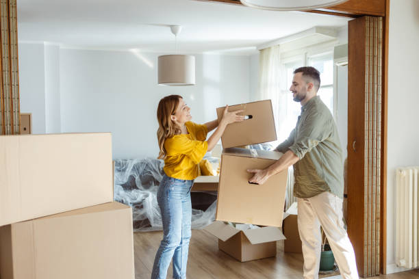 istock Cheerful young couple moving in new home 2155208272