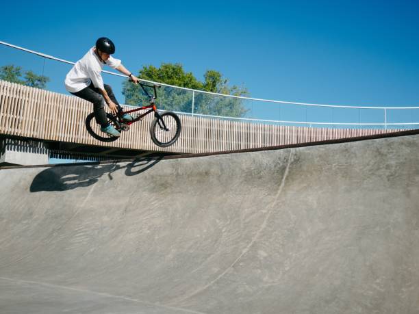 istock BMX rider performing aerial trick on quarter pipe 2155208385