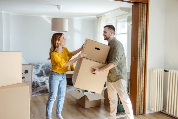istock Cheerful young couple moving in new home 2155208395