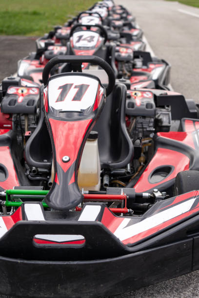 istock Red black go-karts on the side of a track 2155211557