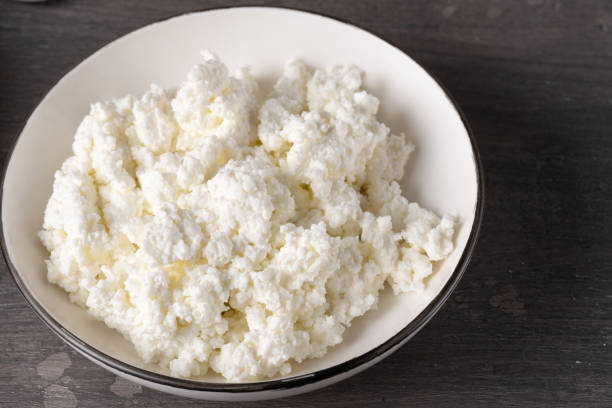 istock Bowl of cottage cheese isolated on grey background, top view 2155213755