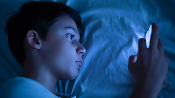 istock Boy connected online with smartphone 2155215114