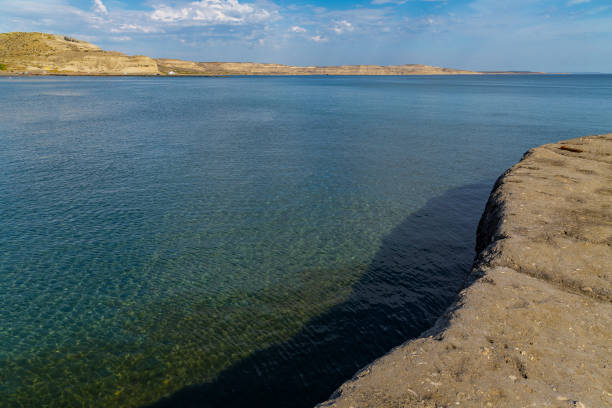 Cliffs contrast with the sea on Puerto Piramides beach, highlight of the protected natural area of the Valdés Peninsula, Patagonia region, Argentina