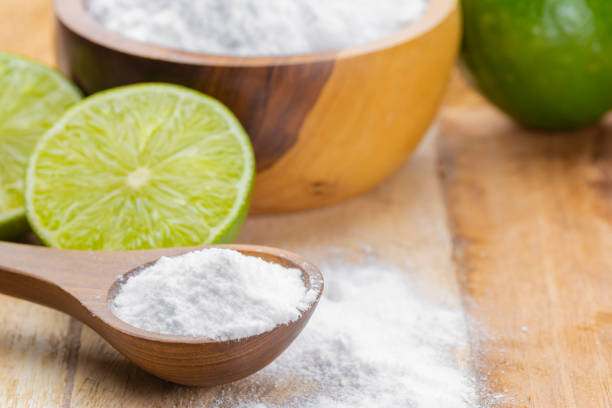 istock Baking soda and lime on a wooden surface 2155218840