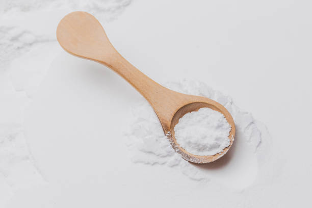 istock Baking soda on wooden spoon, close-up 2155218958