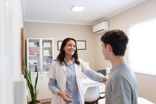 istock Dermatologist in consultation with adolescent patient 2155223169
