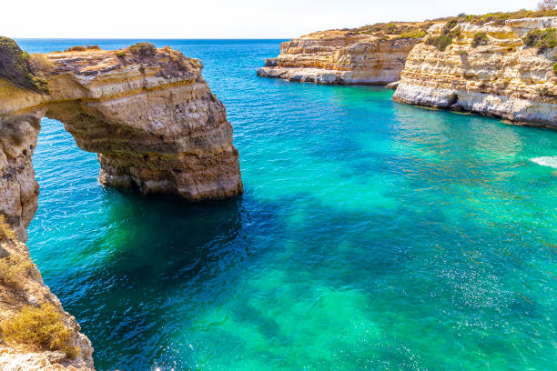 Lagoa, Portugal - circa September, 2017: Natural arch is highlighted in Albandeira Beach, located in the city of Lagoa and one of the most beautiful in the tourist region of the Algarve, in Portugal