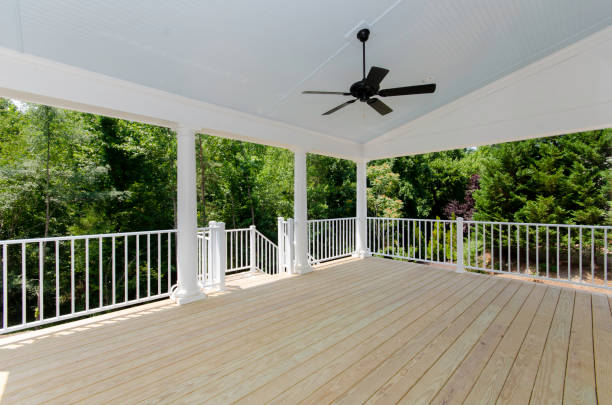 istock Summer Covered Outdoor Deck with Privacy Trees and Ceiling Fan 2155224834