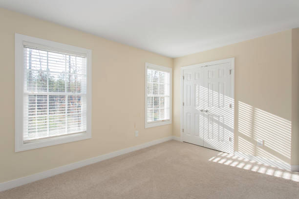 istock Bright Empty Room with Windows and Beige Walls, Carpet Flooring 2155224892