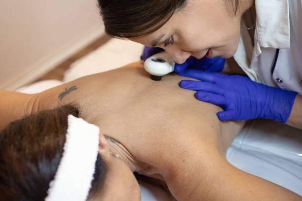 istock Female dermatologist examining her patient with a dermatoscope 2155225144