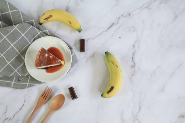 Homemade Banoffee cake made from bananas, whipped cream and a thick caramel sauce on table.