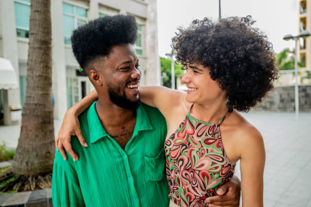 istock Happy couple embracing and talking outdoors 2155228092