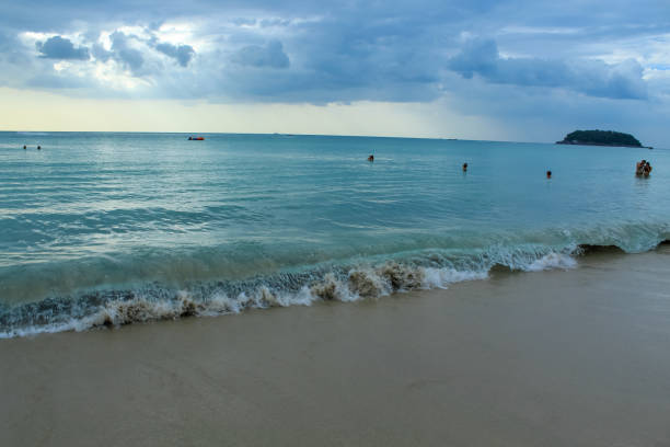 Karon beach in Thailand during the sunset with cloudy sky and copy space, Phuket island
