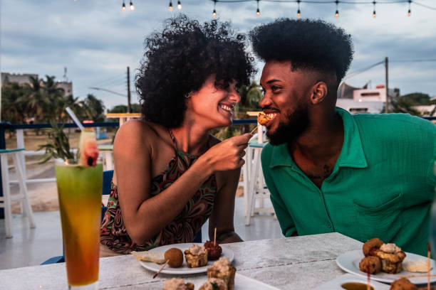 istock Happy couple talking and eating on a restaurant 2155228459