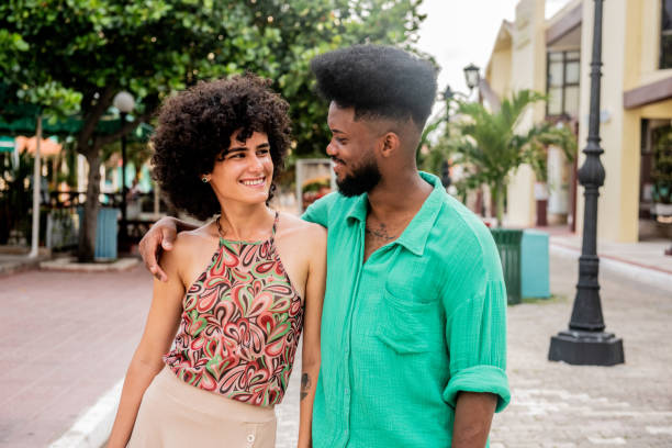 istock Couple talking and walking through the city 2155228478