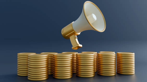 istock isolated a megaphone and gold coins on the dark background 2155228490