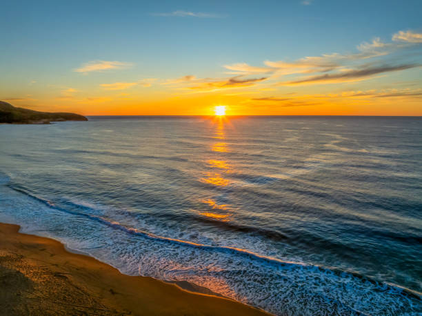 istock Sunrise at the seaside with high cloud 2155228740