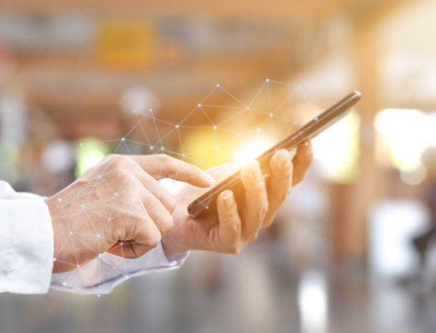 istock Close- up image of man hands with mobile smartphone for searching internet or social networks 2155231284