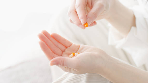 istock Woman taking medicine in room 2155232979