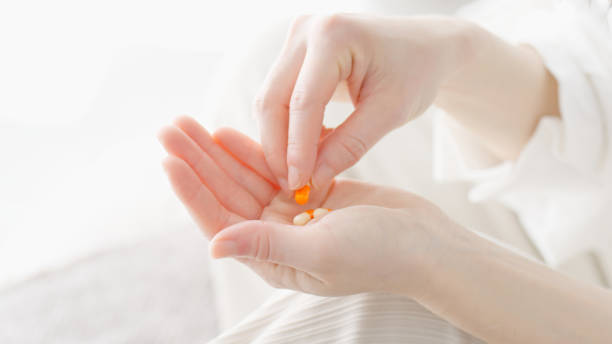 istock Woman taking medicine in room 2155232980