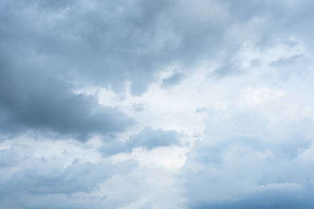 Bright blue sky filled with fluffy white clouds on a sunny day