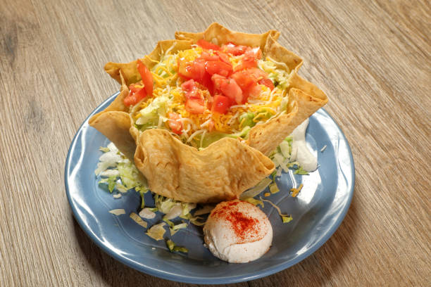 istock Taco salad dish on wooden table 2155233180