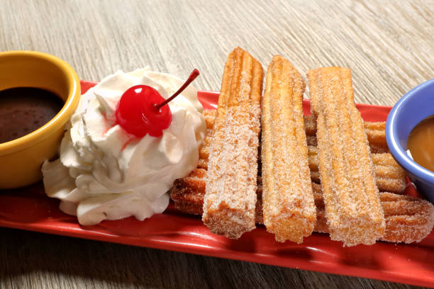 Close up sweet Mexican food churro dish on wooden table