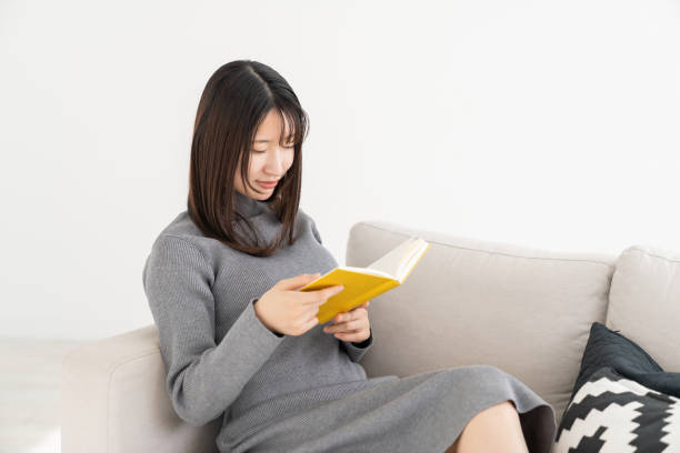 istock asian woman who reads a book, 2155233293