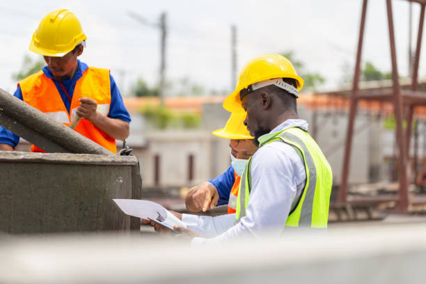 istock Foreman and worker team discussing at precast concrete factory site, Construction workers at work 2155233338