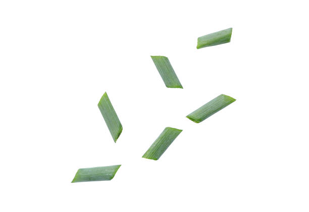 istock Falling cut fresh green onion. fresh green onion slices isolated on white background with clipping path 2155234151