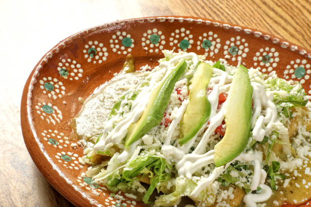 istock Plate of Enchilada Mexican Dish on wooden table 2155234371