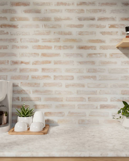 istock A close-up image of a space for displaying products on a marble kitchen against the brick wall. 2155237042
