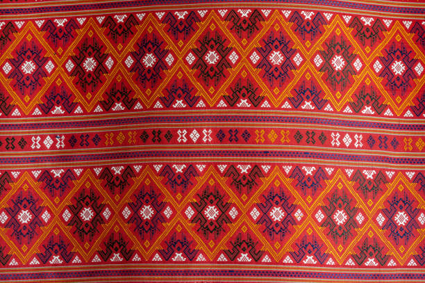 Beautiful seamless Thai pattern Ethnic geometric fabric pattern, embroidered cross stitch, oriental pixel pattern. Brown background, abstract, vector, illustration. Texture, clothing, scarf, decoration, pattern, silk wallpaper.