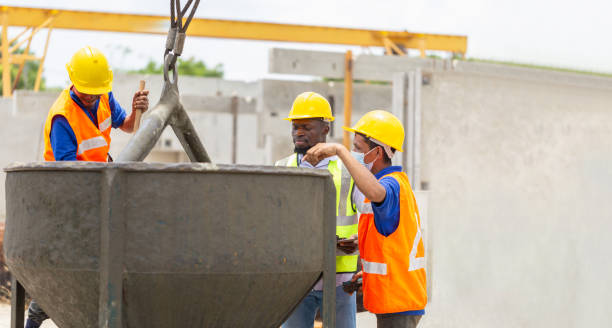 istock Engineer and workers team discussing at precast concrete factory site, Construction workers at work 2155239106