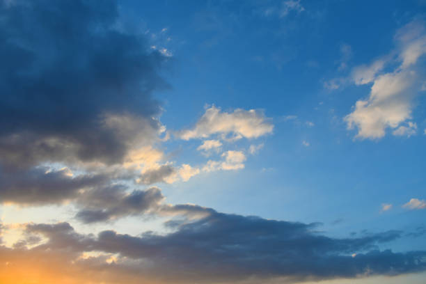 istock Blue sky with dark and white fluffy cloud with sunlight in the evening 2155240978