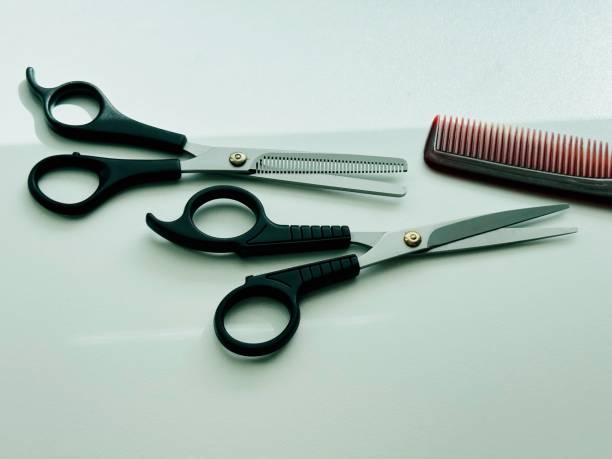 istock Scissors and hairbrush 2155241827