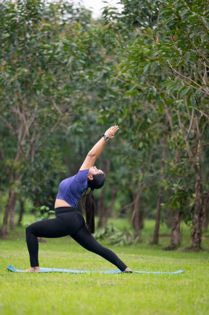 istock Woman Practicing Yoga in Nature 2155246620