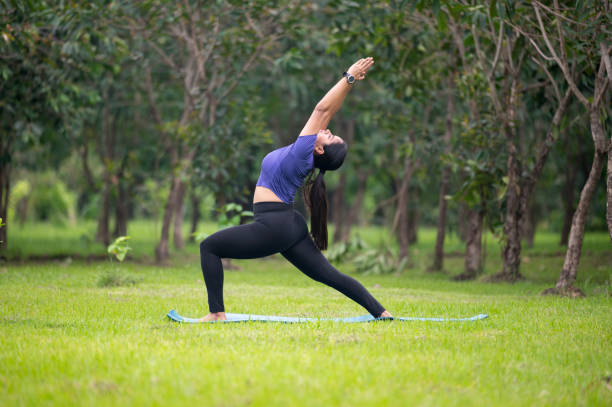 istock Woman Practicing Yoga in Nature 2155246625