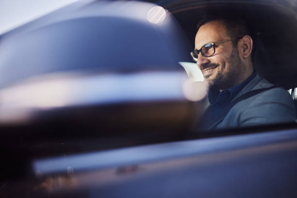 istock Happy businessman going on a trip by car. 2155247422