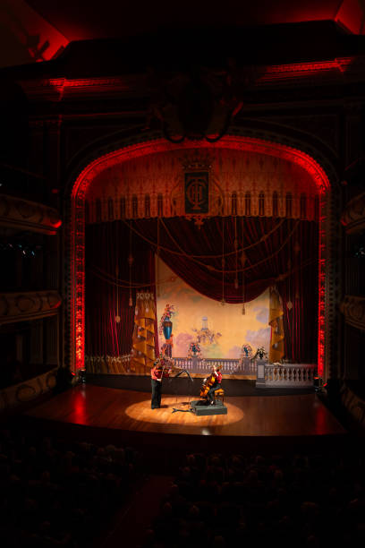 istock Performers on stage in a beautifully lit theater. Classical music concept. 2155247470
