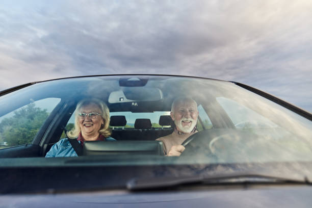 istock Happy mature couple going on a road trip by car. 2155247503