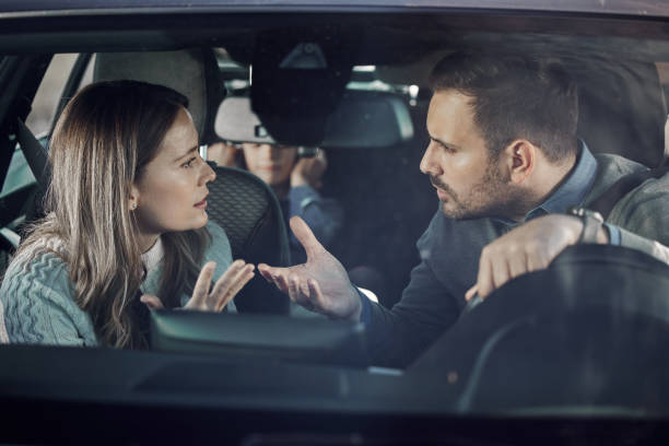 istock Displeased parents having a conflict during trip by a car. 2155247564