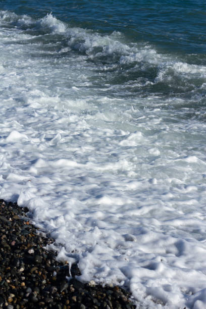 istock Sea wave crashing on the shore 2155249424