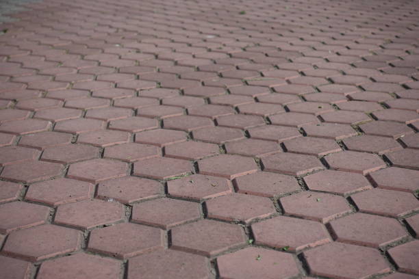 Close view of pink concrete pavement with honeycomb geometric pattern